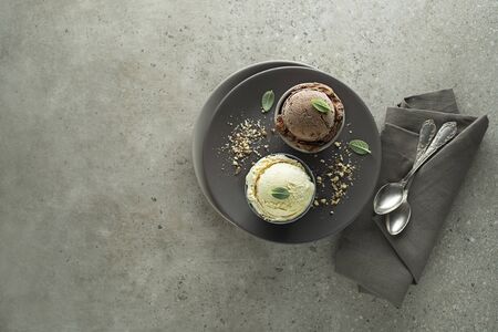 Set of ice cream scoops with chocolate and vanilla flavoursの写真素材