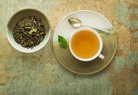 Tea cup with green tea leaf . Healthy conceptの写真素材