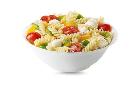 Pasta salad with mozzarella cheese and vegetables isolated on white. Healthy pasta meal.の写真素材