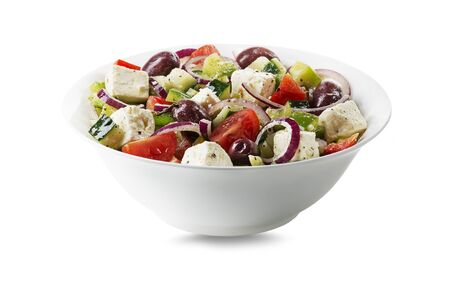 Healthy Salad with feta cheese and fresh vegetables isolated on white background. Greek salad.の写真素材