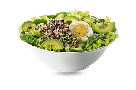 Healthy green salad with quinoa, egg and avocado isolated on white backgroundの写真素材