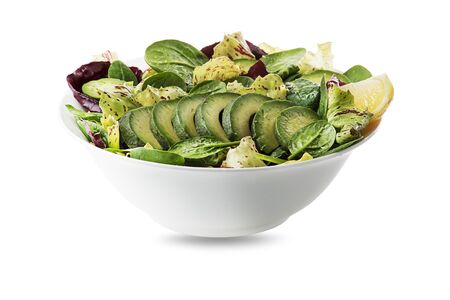 Healthy green salad with avocado isolated on white backgroundの写真素材