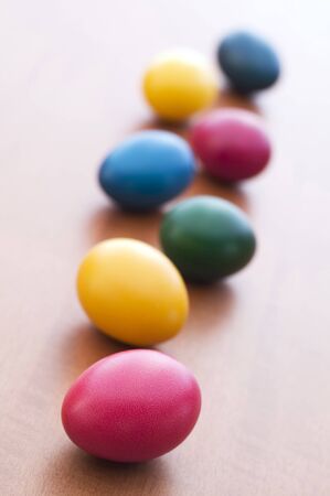Colorful Easter eggs on wooden table background close upの写真素材