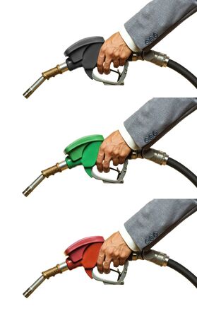 Refueling hoses isolated on white close up. Holding red green yellow color fuel gasoline dispenser background. Petrol price goes down after pandemic coronavirus. low price of fuel.の写真素材