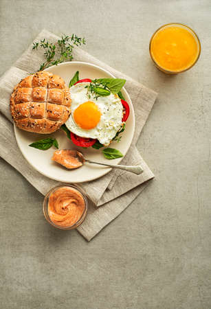Breakfast served with sandwich with egg and orange juice. Delicious classic healthy breakfast.
