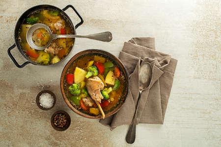 Serving healthy stew with rabbit meat and vegetables on grey backgroundの写真素材