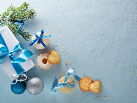 Christmas blue winter background with tasty homemade Christmas sugar cookies of all shapes and sizes. Top view with copy spaceの写真素材