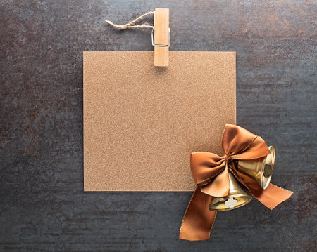 Christmas decorations with golden shining paper card note. Flat lay. Nature New Year holiday concept, top view, copy spaceの写真素材