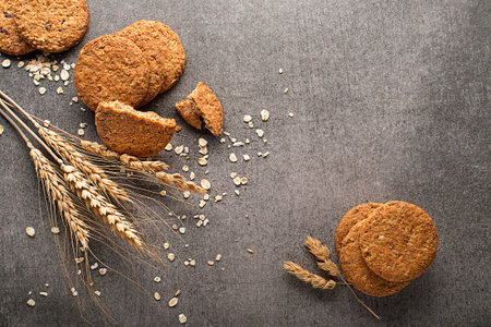 Homemade cereal oatmeal cookies on grey table background. Healthy Food Snack Concept. Copy space
