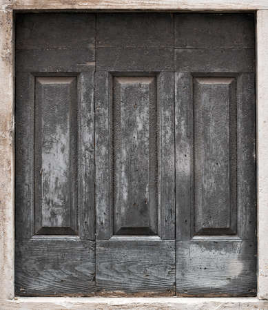 Old silver door with empty grunge canvasの写真素材