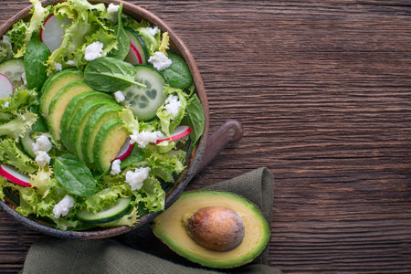 Healthy Green salad with avocado and fresh cheeseの写真素材