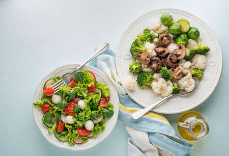 Healthy salad meals with cooked vegetable and fresh lettuce salad. Healthy vegetable diet meal.の写真素材