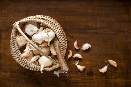 Garlic cloves on wooden vintage backgroundの写真素材
