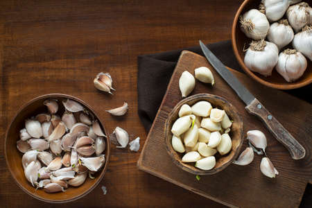 Garlic cloves on wooden vintage background. Garlic cookingの写真素材