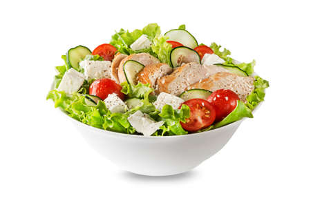 Fresh green salad with chicken breast feta cheese and tomato isolated on white backgroundの写真素材