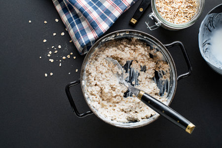 Oatmeal plate. Cooked oatmeal served with fresh yogurt. Healthy food, diet. Top view.の写真素材