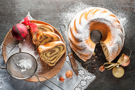 Potica, traditional Slovenian bread cake roll with , sweet bread roll stuffed with walnuts and sprinkle with sugar. Christmas holidays celebration dessertの写真素材