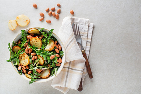 Dandelion salad with bean and potato close upの写真素材