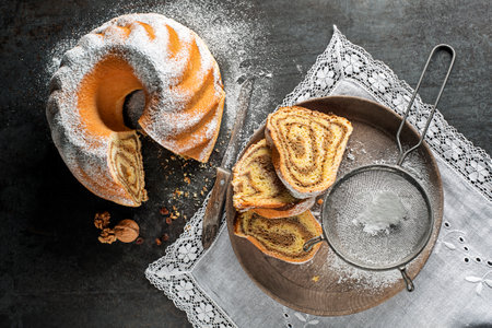 Potica, traditional Slovenian bread cake roll with walnuts. Sweet bread roll stuffed with walnuts and sprinkle with sugarの写真素材