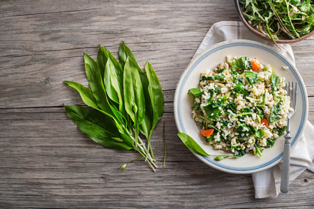 Fresh risotto with ramson or wild garlic pesto. Healthy spring food conceptの写真素材
