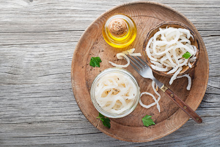 Traditional fresh and healthy sour turnip in glass jar on wooden background.の写真素材
