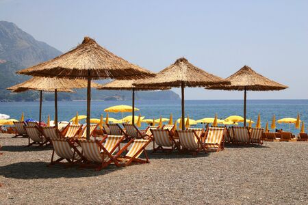 Beach umbrellas and plank bedsの写真素材