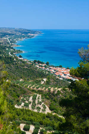 Marine landscape. Greece, Kassandra. Blue sae and sky, small towns with red roofs.の写真素材