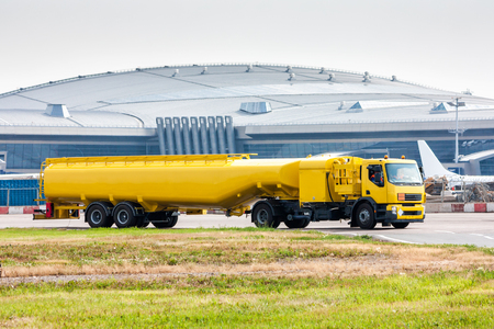 Yellow tank truck aircraft refueler at the airport apronの写真素材