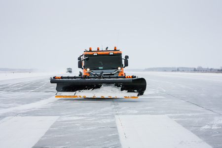 Snow machines on the winter runwayの写真素材