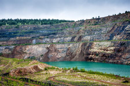 Quarry flooded with turquoise waterの写真素材