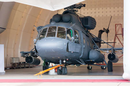 Heavy military helicopter in the hangarの写真素材