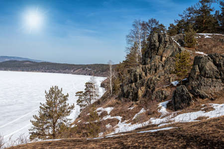 Beautiful lake and rocky shore at winter dayの写真素材