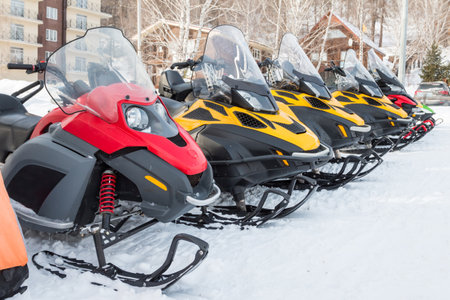 <p>Parking of snowmobiles in a mountain village in winter</p>の写真素材