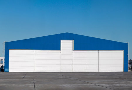 Aviation hangar outside on a clear dayの写真素材