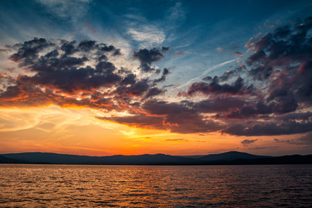 A beautiful lake against the backdrop of a scenic sunriseの写真素材