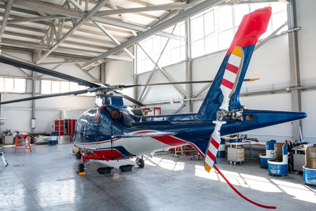 The passenger helicopter in the aviation hangar. Back viewの写真素材