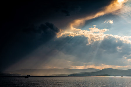 Rays of sun over the lake after heavy rainの写真素材