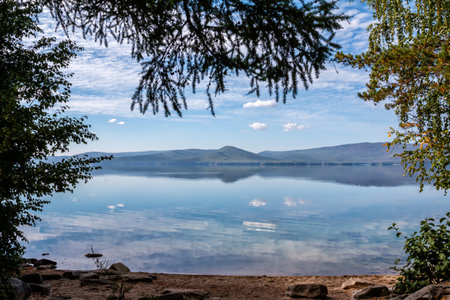 Picturesque shore of a mountain lakeの写真素材