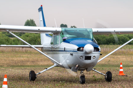 Close-up of the small private airplane with the engine running at the airfieldの写真素材