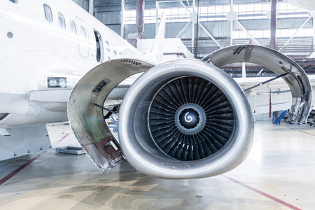 Close-up of an open high bypass turbofan airplane engine of a passenger aircraft in an aviation...