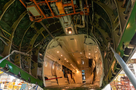 Open cargo cabin of transport freight airplane in aircraft hangar