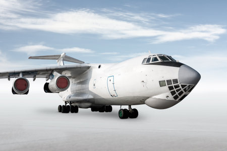 White wide body transport freight airplane isolated on bright background with sky