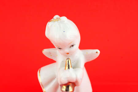 Isolated christmas decoration on red background (Angel)の写真素材