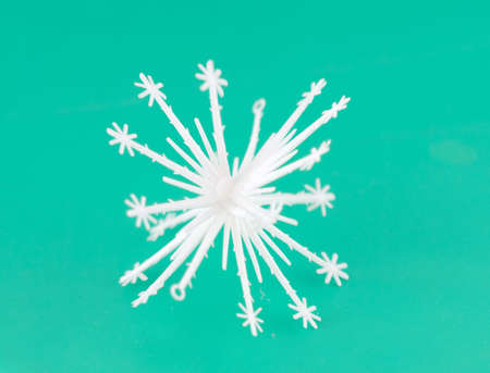 white snowflake isolated on green