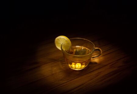 Still life - cup of tea with lemon (low-key image).の写真素材