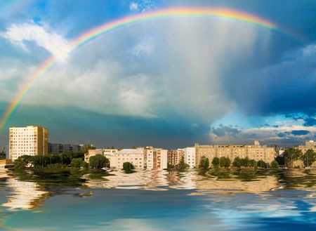 Rainbow above the city (can be used how background or wallpaper)の写真素材