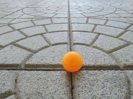 orange ball underfootの写真素材