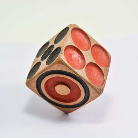 One wooden dice on white background