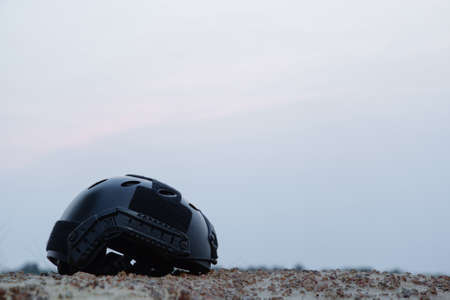 Modern combat helmet in the darkness.の写真素材