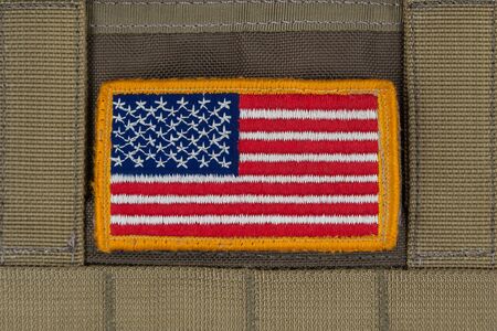 Rounded American flag patch on U.S. military combat uniform,Marine Coyote Color.